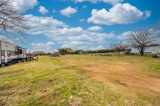 view of yard with a rural view