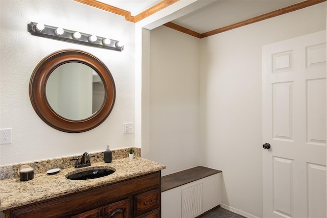 bathroom featuring vanity and ornamental molding