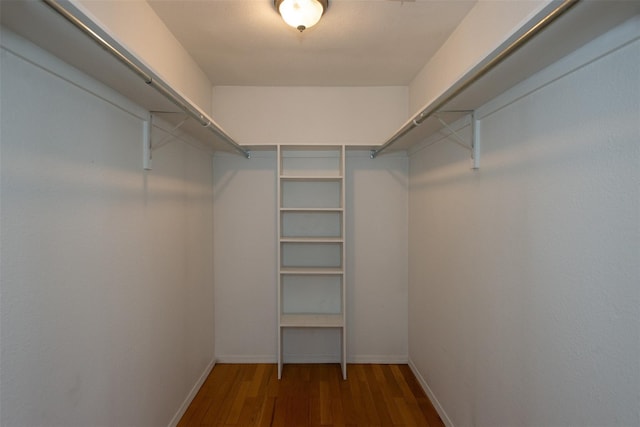 spacious closet with wood finished floors