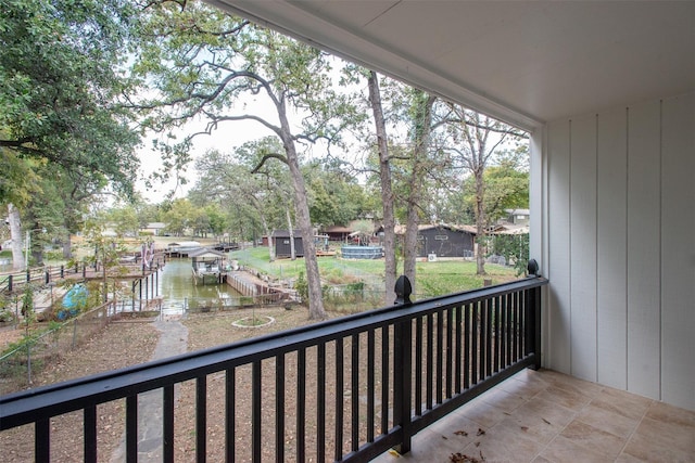 balcony featuring a boat dock