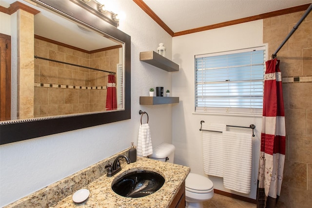 full bathroom with vanity, a tile shower, tile patterned flooring, crown molding, and toilet