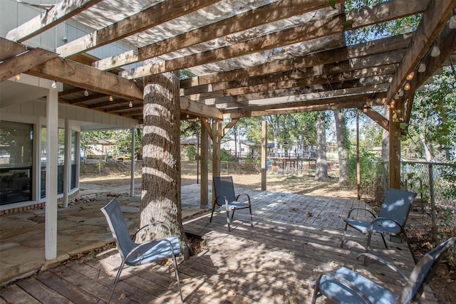 view of patio / terrace featuring a deck and fence