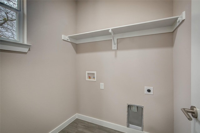 washroom with dark wood-style floors, washer hookup, electric dryer hookup, laundry area, and baseboards