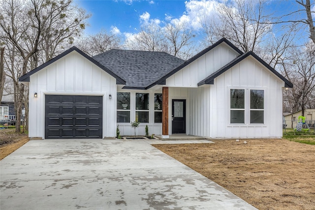 modern inspired farmhouse with board and batten siding, concrete driveway, roof with shingles, and an attached garage