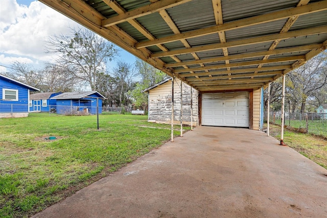 exterior space featuring a garage, fence, and concrete driveway