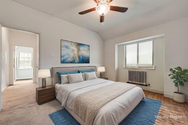215 Tallgrass Dr, Lavon, TX 75166 - bedroom with radiator, vaulted ceiling, light wood-style flooring, and a ceiling fan