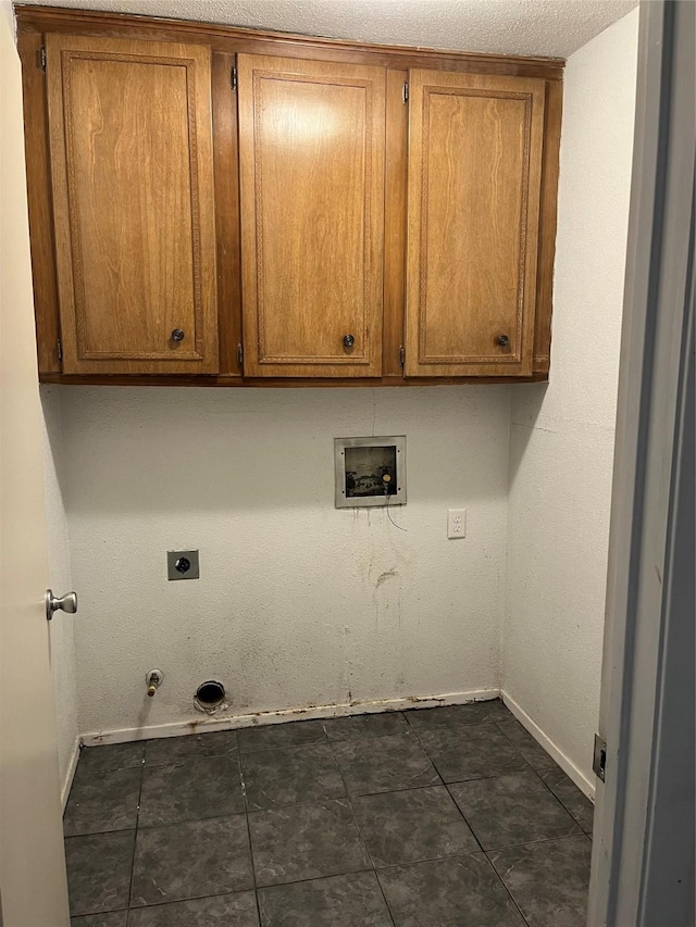 laundry area with cabinet space, baseboards, hookup for a gas dryer, washer hookup, and electric dryer hookup