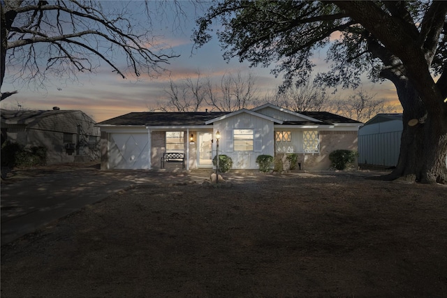 ranch-style home featuring driveway and an attached garage