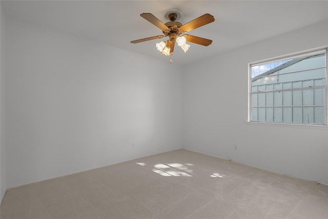 unfurnished room with carpet and ceiling fan