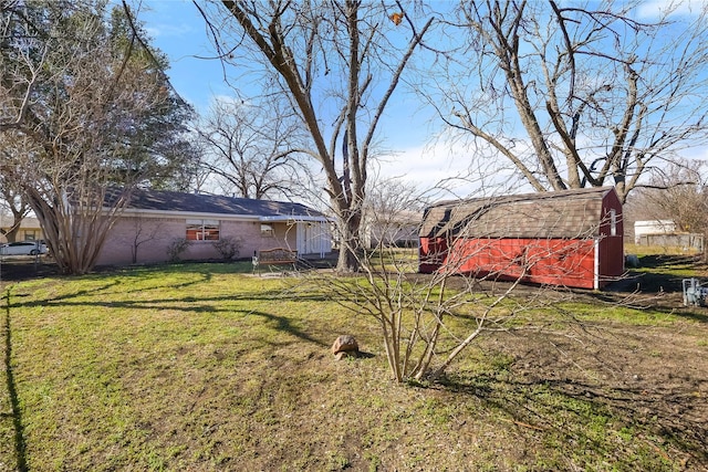 view of yard with an outbuilding and a barn