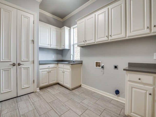 washroom with washer hookup, cabinet space, ornamental molding, a sink, and electric dryer hookup