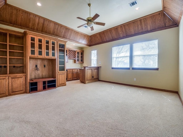 interior space featuring a ceiling fan, light colored carpet, visible vents, and baseboards