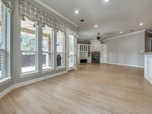 unfurnished living room featuring visible vents, ceiling fan, light wood-type flooring, a fireplace, and recessed lighting