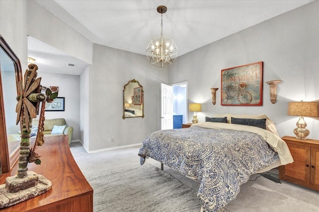 carpeted bedroom with a chandelier, a textured ceiling, and baseboards