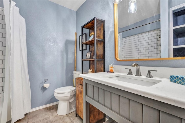 bathroom with a textured wall, a shower with shower curtain, toilet, vanity, and baseboards