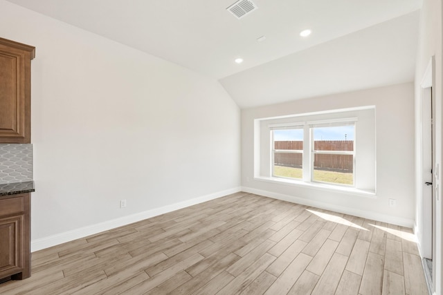 207 Cortese Ln, Alvarado, TX 76009 - spare room featuring visible vents, baseboards, and light wood-type flooring