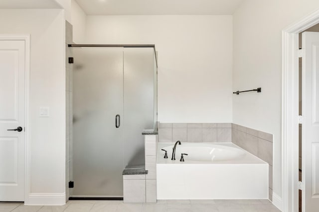 207 Cortese Ln, Alvarado, TX 76009 - bathroom featuring a shower stall, a bath, and tile patterned floors