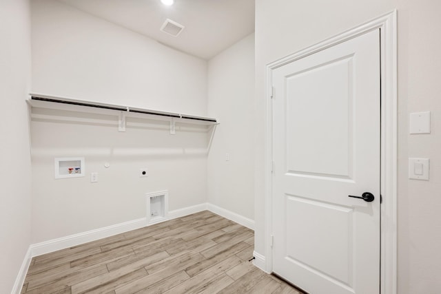 207 Cortese Ln, Alvarado, TX 76009 - laundry area featuring electric dryer hookup, light wood-type flooring, gas dryer hookup, visible vents, and laundry area
