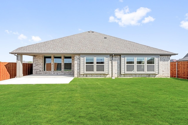 207 Cortese Ln, Alvarado, TX 76009 - back of house with a patio, roof with shingles, brick siding, a fenced backyard, and a yard