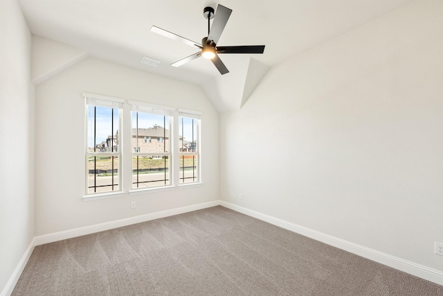 207 Cortese Ln, Alvarado, TX 76009 - spare room featuring a ceiling fan, baseboards, vaulted ceiling, and carpet
