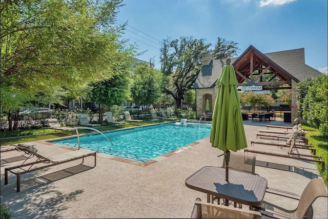 view of swimming pool featuring a gazebo, a patio area, and a fenced in pool