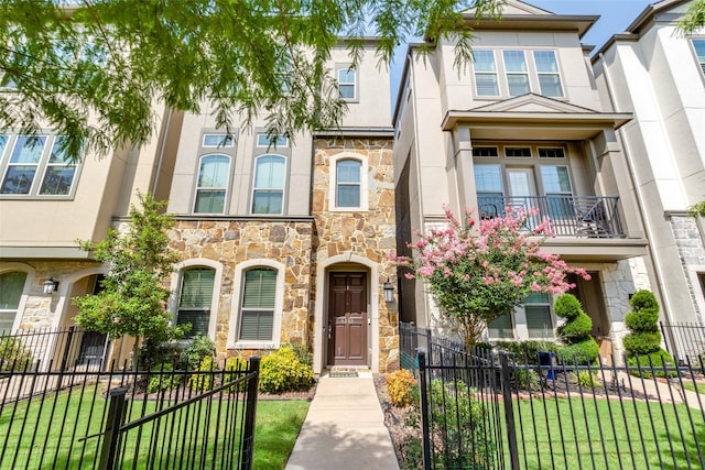 townhome / multi-family property with fence and stucco siding