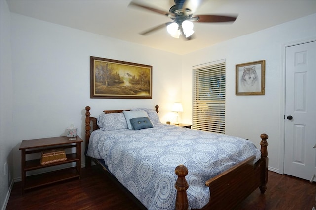 bedroom with ceiling fan, baseboards, and wood finished floors