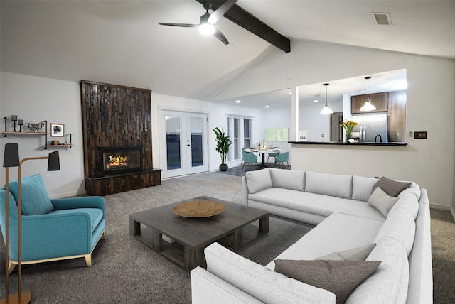 carpeted living area featuring vaulted ceiling with beams, a fireplace, visible vents, baseboards, and french doors