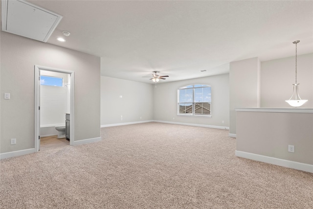 carpeted empty room featuring attic access, baseboards, ceiling fan, and recessed lighting