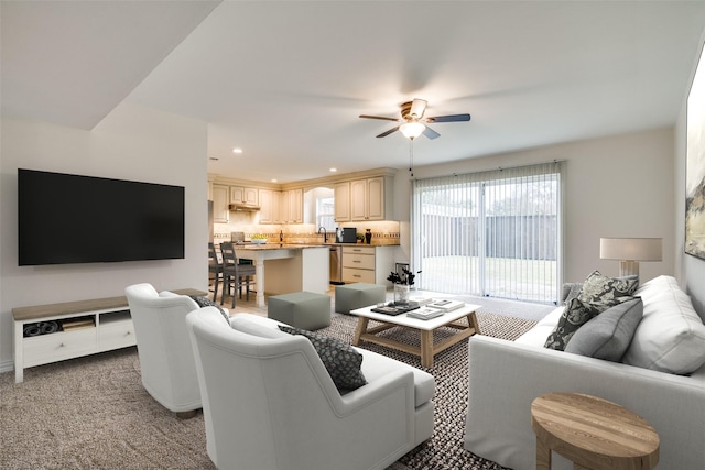 living room featuring a ceiling fan, recessed lighting, and light carpet