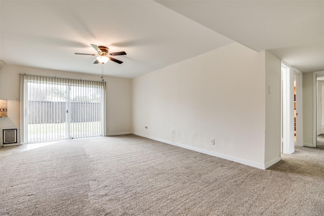 unfurnished room with carpet, baseboards, and ceiling fan