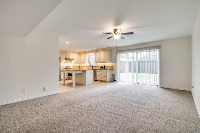 unfurnished living room featuring recessed lighting, baseboards, ceiling fan, and light colored carpet