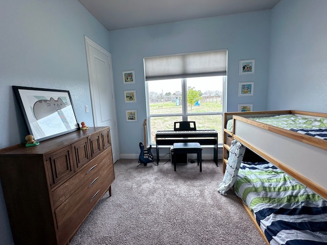 bedroom with baseboards and carpet flooring