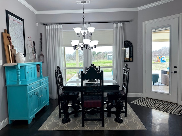 dining room featuring a chandelier, ornamental molding, visible vents, and baseboards