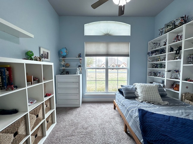 bedroom featuring a ceiling fan and carpet