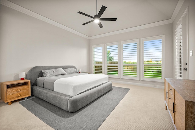 bedroom featuring ornamental molding, a ceiling fan, and light colored carpet