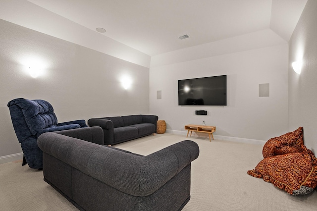 living area with carpet floors, visible vents, and baseboards