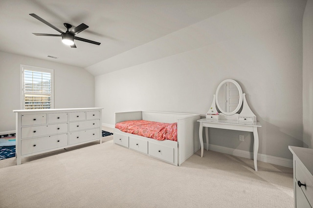 bedroom with baseboards, visible vents, light colored carpet, lofted ceiling, and ceiling fan