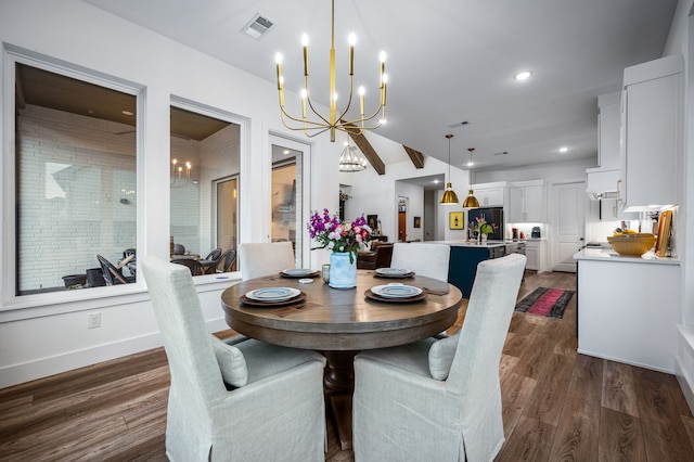 dining room featuring dark wood-style floors, recessed lighting, visible vents, and a notable chandelier