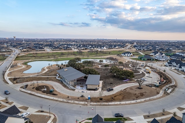 birds eye view of property with a residential view and a water view