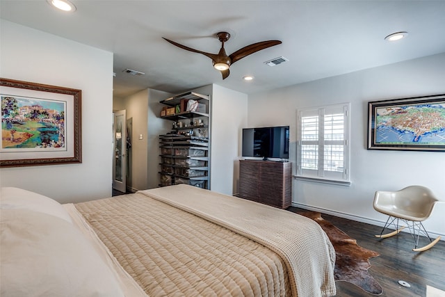 bedroom featuring recessed lighting, wood finished floors, visible vents, and baseboards