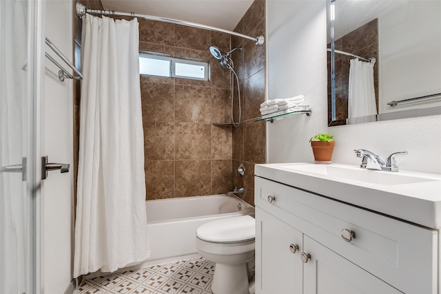 full bath featuring toilet, vanity, and shower / bath combo