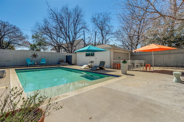 view of pool featuring outdoor dining space, a patio, a fenced backyard, and a fenced in pool