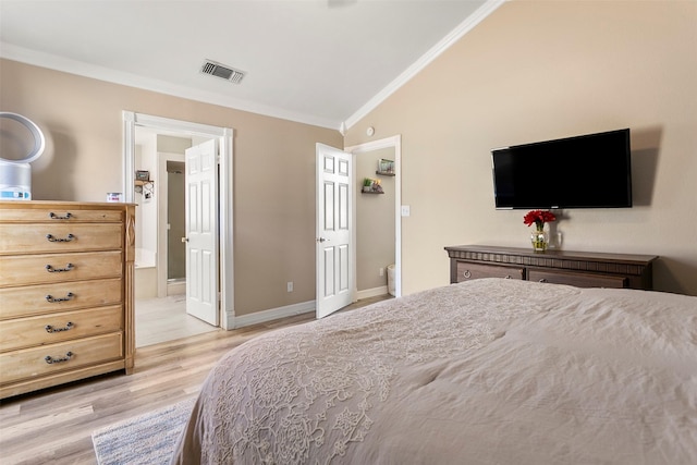 bedroom featuring visible vents, baseboards, light wood-style flooring, ornamental molding, and vaulted ceiling