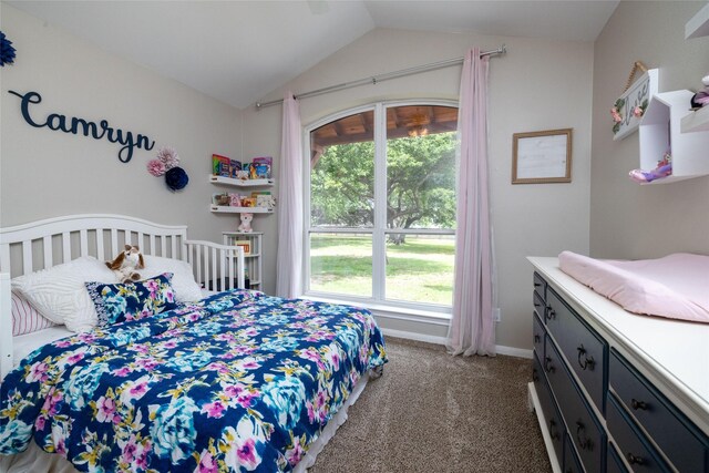 carpeted bedroom featuring vaulted ceiling and baseboards