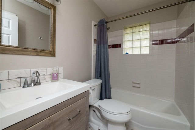 full bathroom featuring vanity, toilet, and shower / tub combo with curtain