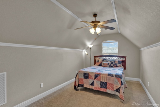 carpeted bedroom with lofted ceiling, ceiling fan, visible vents, and baseboards