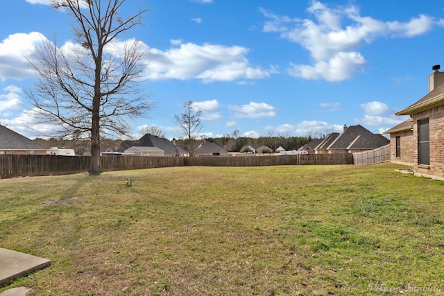 view of yard with a fenced backyard