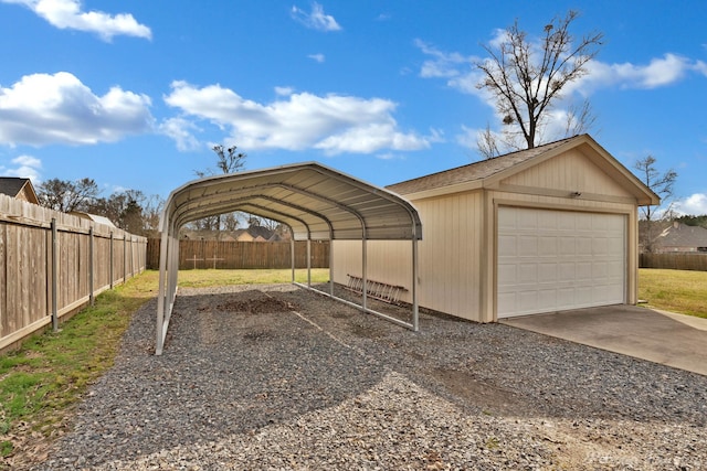 view of vehicle parking with a garage, fence, and a carport