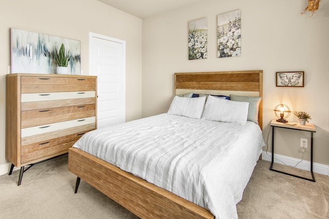 carpeted bedroom featuring baseboards